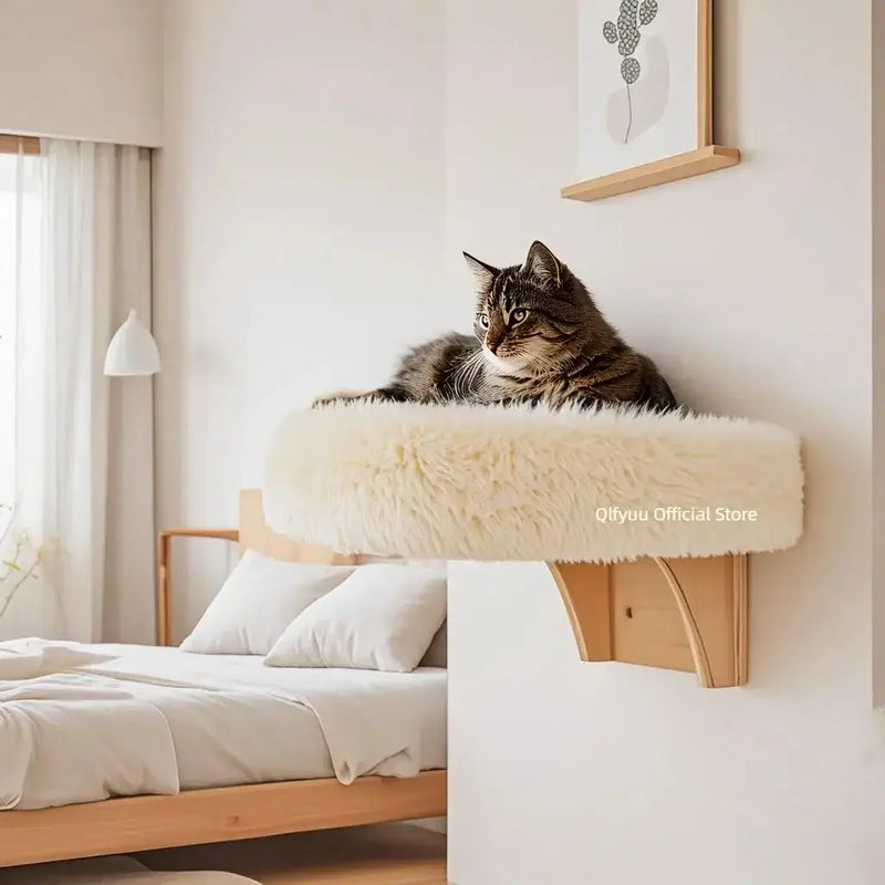 Load image into Gallery viewer, Wall mounted wooden cat bed with soft cushion and sturdy hardwood frame attached to wall in cozy bedroom
