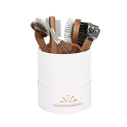 Sustainable pet grooming set with wooden comb and nail clipper.