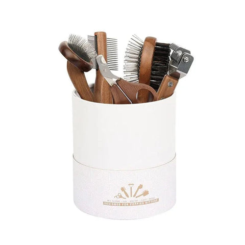 Sustainable pet grooming set with wooden comb and nail clipper.